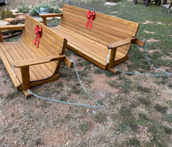 Quality Patio Furniture 5 ft. and 6 ft. Low Back Porch Swing make great holiday gifts! (830) 367-3848 5 ft. and 6 ft. Low Back Porch Swings with red bows on them for Christmas. Porch swings make great gifts! Quality Patio Furniture Handcrafted by Jack Hudson (830) 367-3848