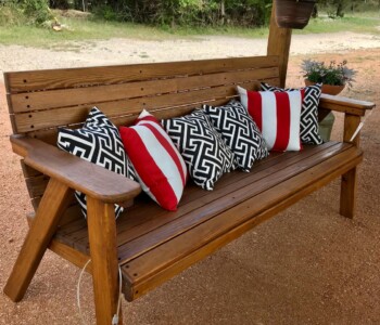 Quality Patio Furniture handcrafted 6 ft. Low Back Couch is so comfortable you really don’t need cushions -- but who doesn’t love a pop of color? (830) 367-3848 Quality Patio Furniture 6 ft. Low Back Couch with red striped and black patterned cushions