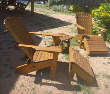 Quality Patio Furniture Curved Back Adirondack ChairsHandcrafted by Jack Hudson (830) 367-3848 Curved Back Adirondack Chairs with Footstools and Side Table on the sales lot of Quality Patio Furniture Handcrafted by Jack Hudson (830) 367-3848