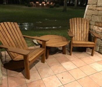 Quality Patio Furniture Curved Back Adirondack Chairs with Round Side Table Handcrafted by Jack Hudson (830) 367-3848 Quality Patio Furniture Curved Adirondack Chairs on Tile Patio with 36" Round Side Table Quality Patio Furniture Handcrafted by Jack Hudson (830) 367-3848