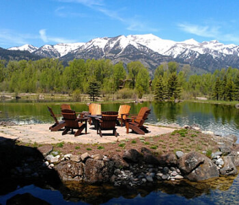 Quality Patio Furniture Curved Back Adirondack Chairs with a scenic view of the Grand Tetons... Handcrafted by Jack Hudson (830) 367-3848 Curved Back Adirondack Chairs with a scenic view of the Grand Tetons in the background. Quality Patio Furniture Handcrafted by Jack Hudson (830) 367-3848