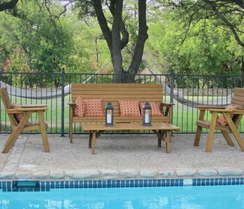 Quality Patio Furniture handcrafted Couch displayed with Deck Chairs and Cocktail table poolside (830) 367-3848 Quality Patio Furniture Couch with Deck Chairs and Cocktail table set up poolside