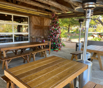 Quality Patio Furniture Heavy Duty Picnic Tables with Separate Benches are shown in a variety of sizes. Handcrafted by Jack Hudson (830) 367-3848 Heavy Duty Picnic Tables with Separate Benches in a variety of sizes are shown on a patio with a Christmas tree and outdoor heaters. Quality Patio Furniture Handcrafted by Jack Hudson (830) 367-3848