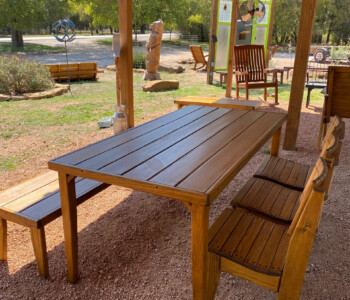 Quality Patio Furniture 6 ft. Outdoor Dining Table - Roarke Style with 3 Curved Seat Dining Chairs on one side of the table and one 6 ft. Courtside Bench Handcrafted by Jack Hudson (830) 367-3848 6 ft. Outdoor Dining Table - Roarke Style with 3 Curved Seat Dining Chairs on one side of the table and one 6 ft. Courtside Bench Quality Patio Furniture Handcrafted by Jack Hudson (830) 367-3848
