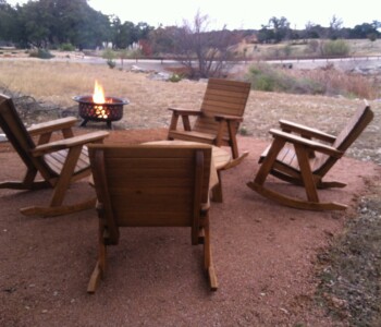 Quality Patio Furniture - Watching stars in Rocking Chairs Handcrafted by Jack Hudson (830) 367-3848 Watching stars in Rocking Chairs near a firepit Quality Patio Furniture Rocking Chairs around Round Cocktail Table with firepit