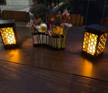 Quality Patio Furniture Outdoor Dining Table decorated Jack Hudson (830) 367-3848 Outdoor Dining Table decorated Texas Chic with Lantern Candles and flowers Quality Patio Furniture Jack Hudson (830) 367-3848